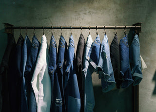 Outland Denim jeans hanging on clothes rack