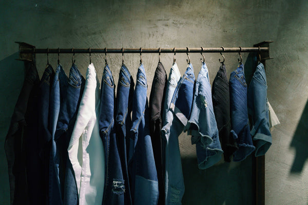 Outland Denim jeans hanging on clothes rack